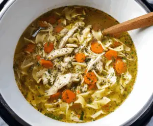 Creamy and hearty Instant Pot Chicken Noodle Soup in a bowl with vegetables and tender chicken pieces, perfect for a comforting meal