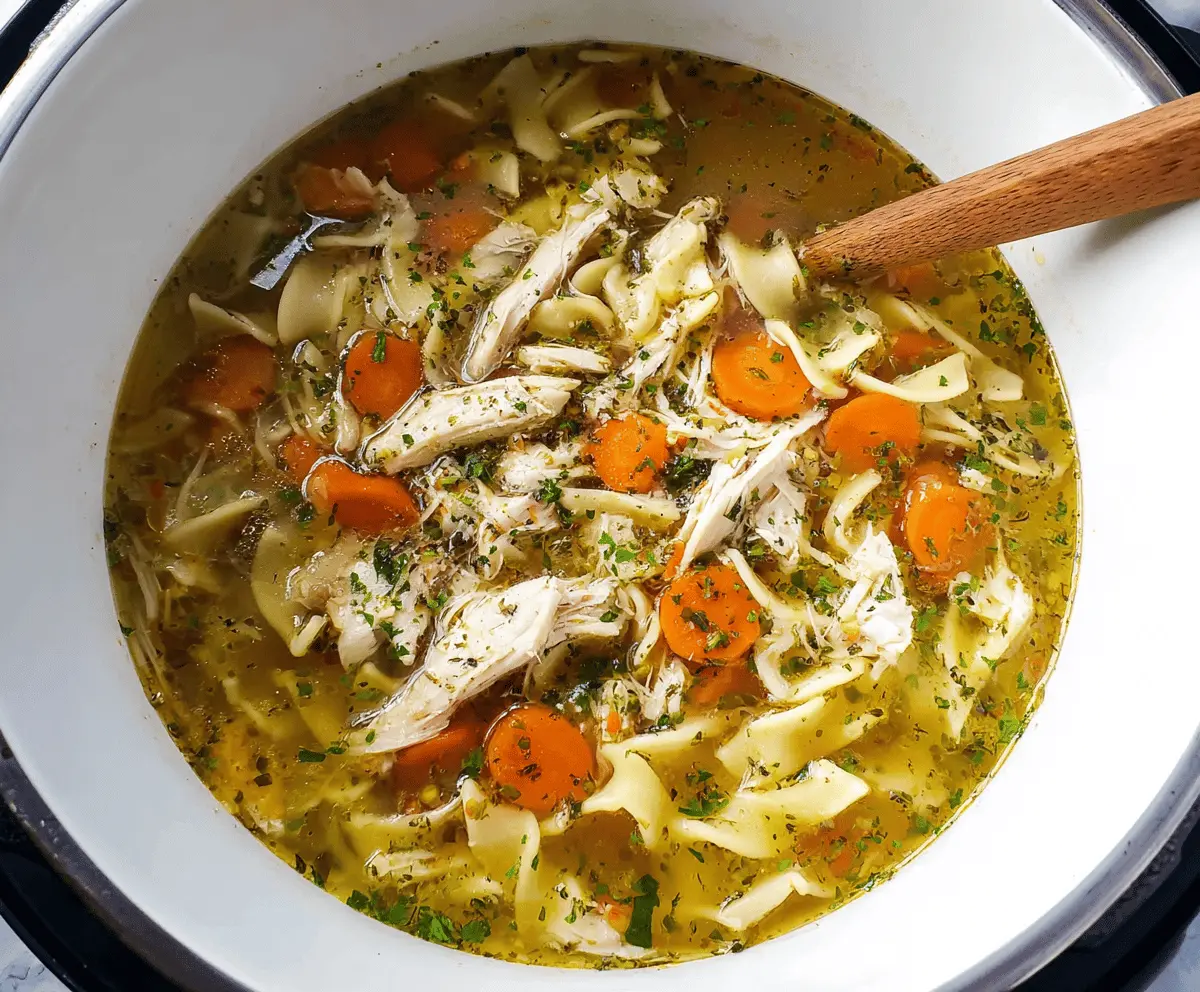 Creamy and hearty Instant Pot Chicken Noodle Soup in a bowl with vegetables and tender chicken pieces, perfect for a comforting meal